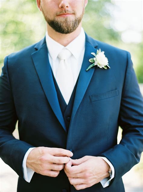 navy suit floral tie wedding.